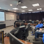 Photo of students participating in a YellowH@ckets design review session