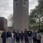 Robo-dogs in front of clock tower