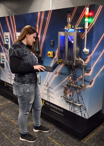 Photo of a female student working with the CyberHive