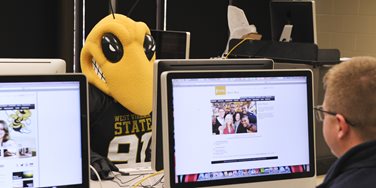 Mascot surfing the internet