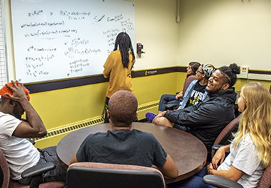 Instructor working with a group of students