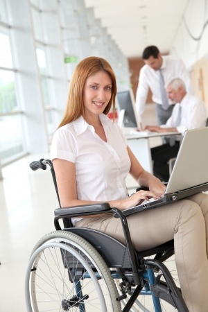 wheelchair user with a laptop on her lap